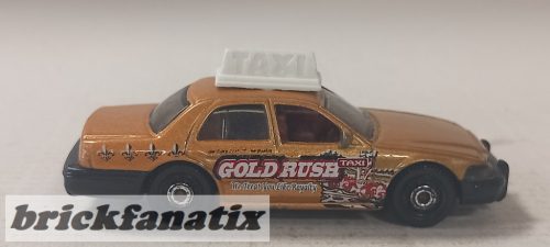 Matchbox 2006 Ford Crown Victoria - Gold Rusb TAXI